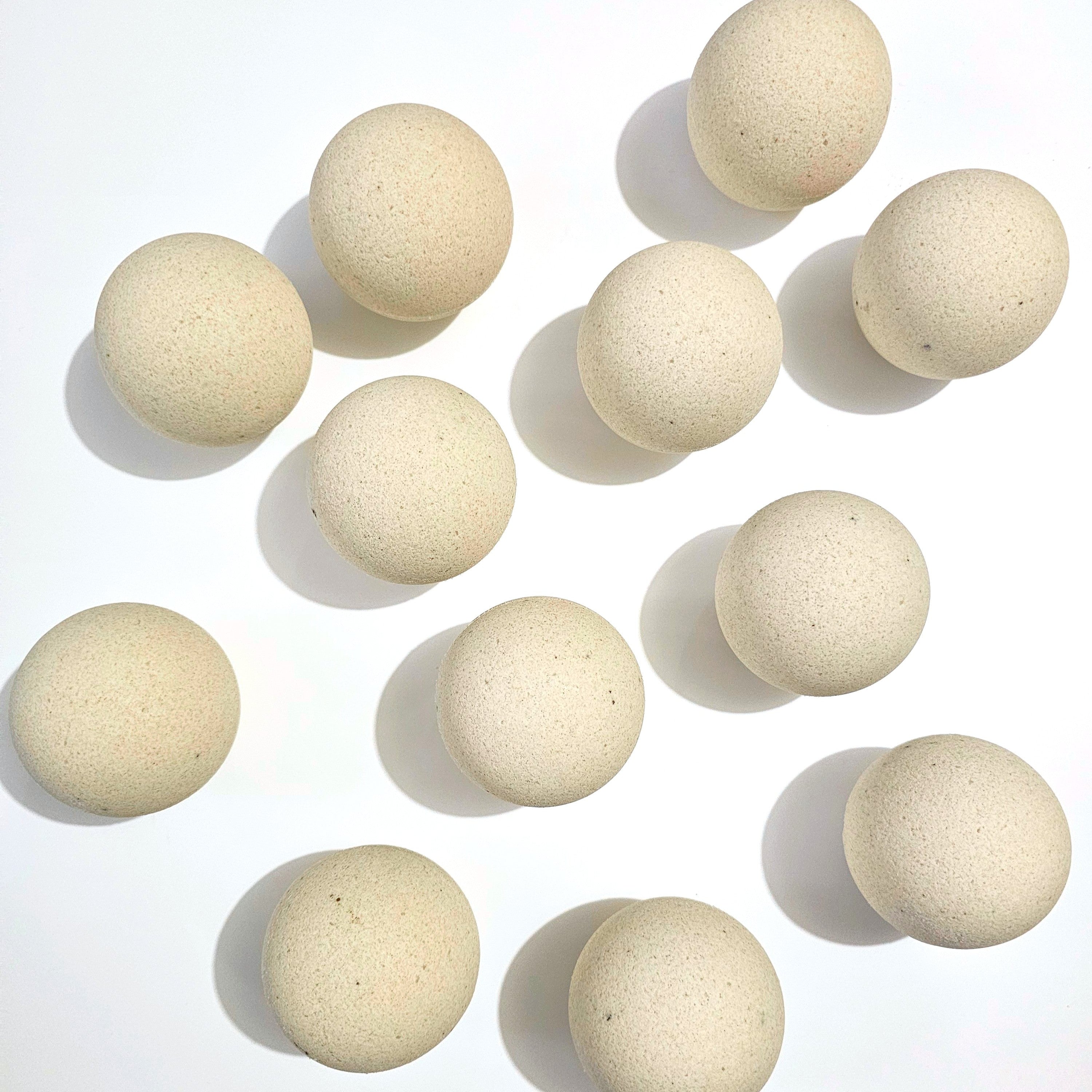 Multiple Bath Bombs arranged on a white background